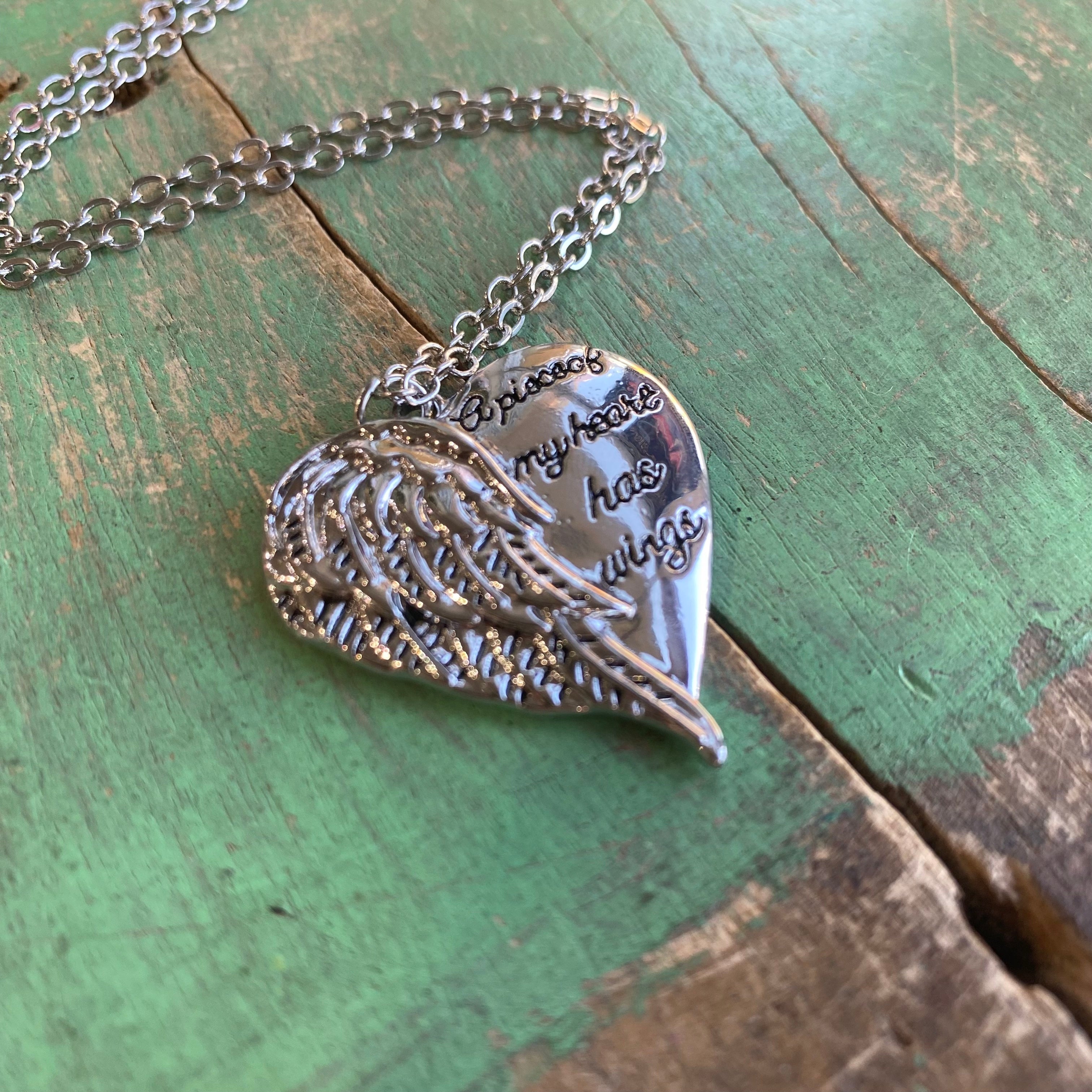 A piece of my sale heart has wings necklace